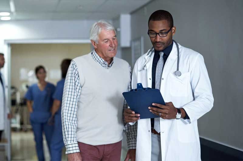Senior man with physician